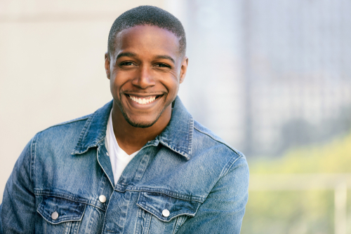 Smiling man showing a confident smile after receiving dental fillings